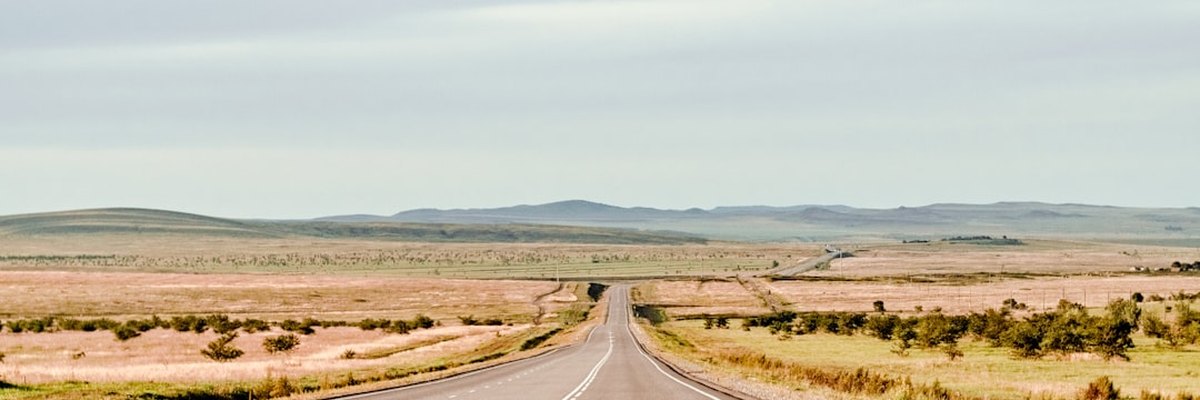 an empty road in the middle of nowhere