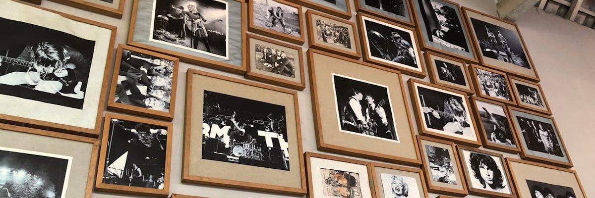 a wall full of black and white photographs